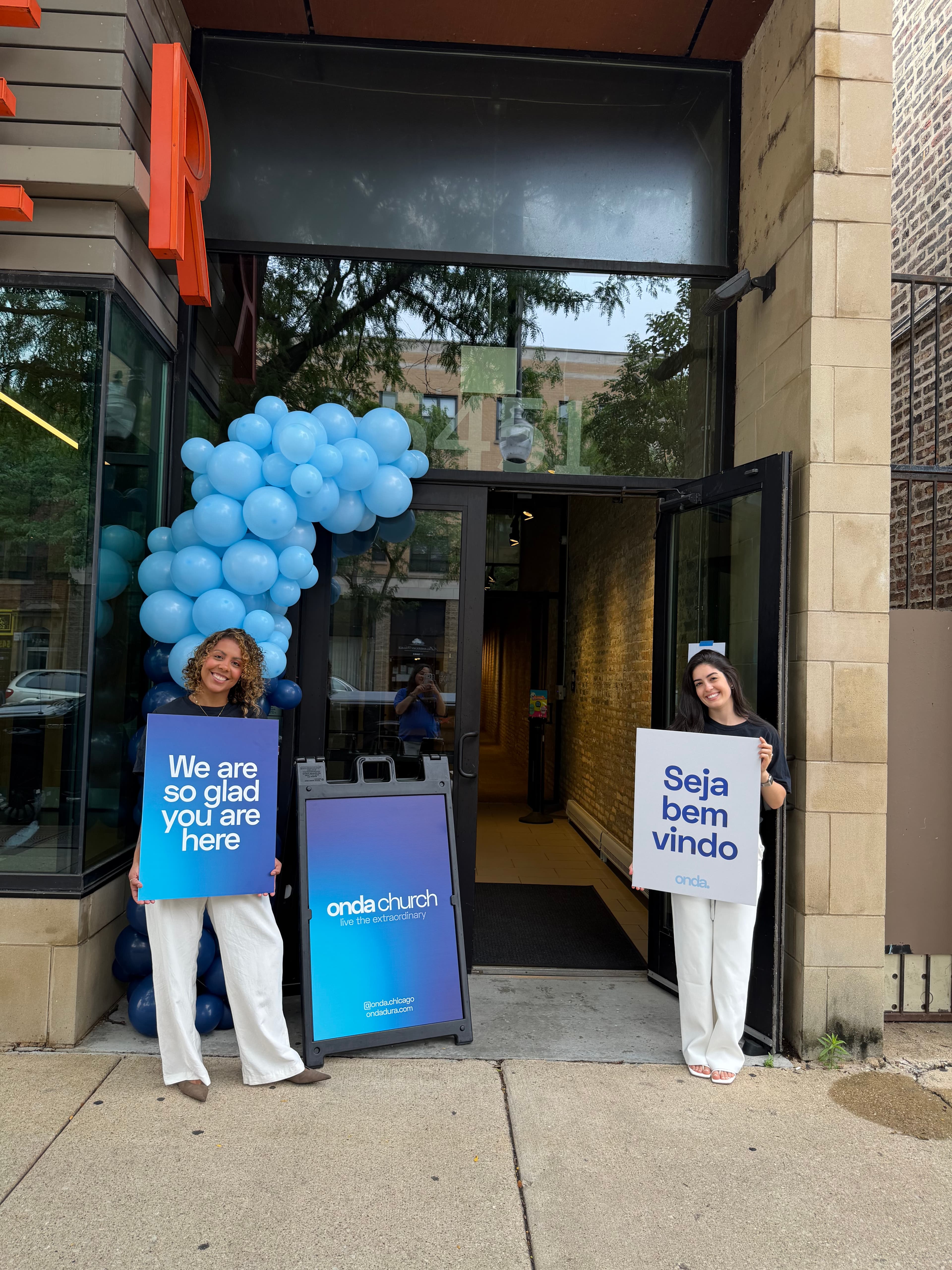 Onda Church welcome team greeting guests at the entrance